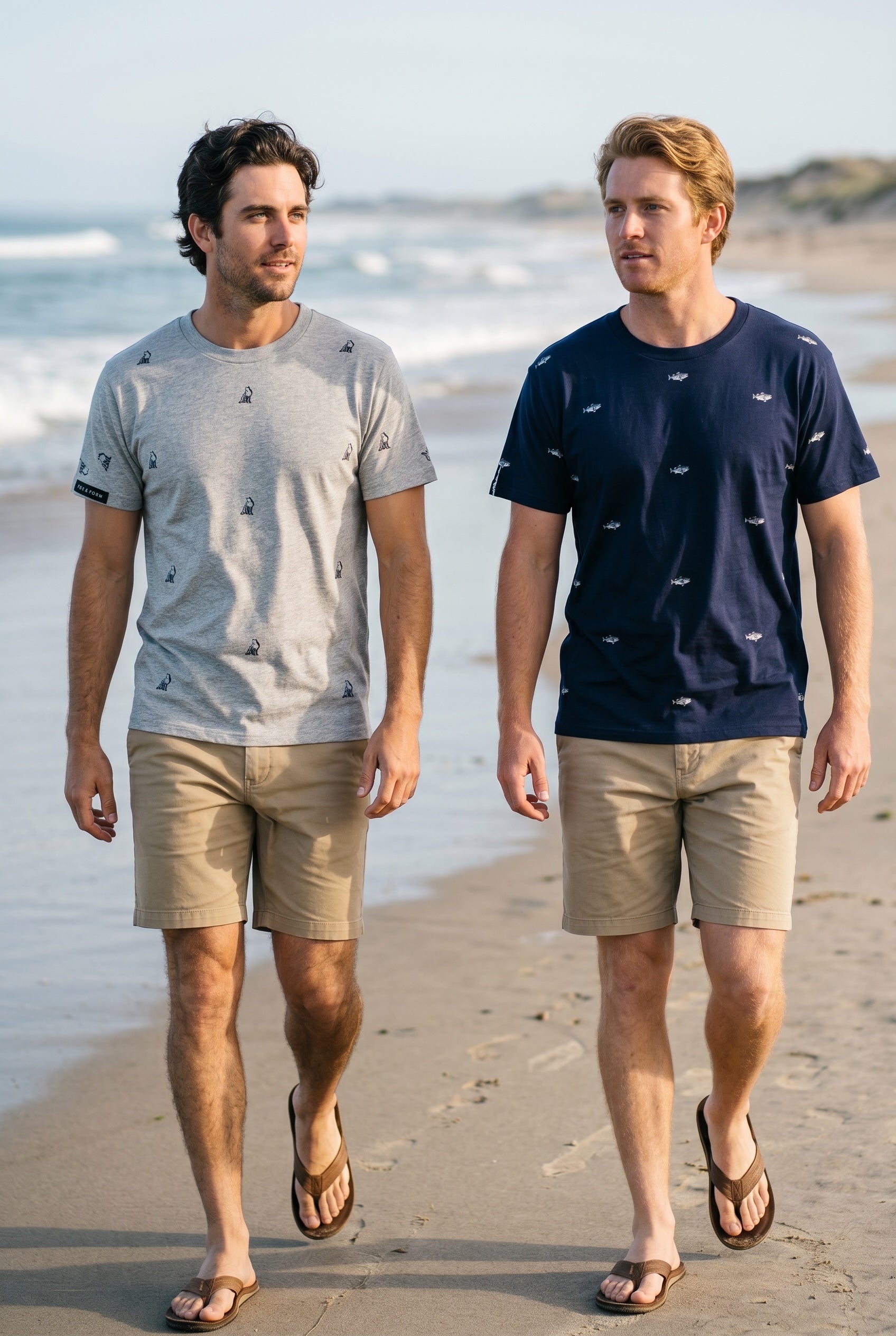 Man sitting on beach wearing Fox and Form black signature tee